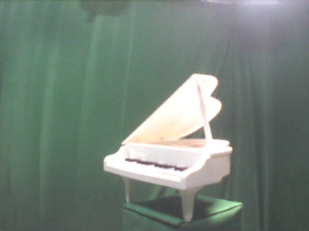 45 Degrees _ Picture 9 _ White Electric Grand Piano 2.png